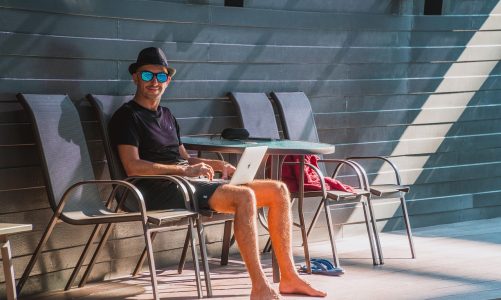 Man, laptop, work — Top Volunteer Abroad Destinations You Should Consider This Year